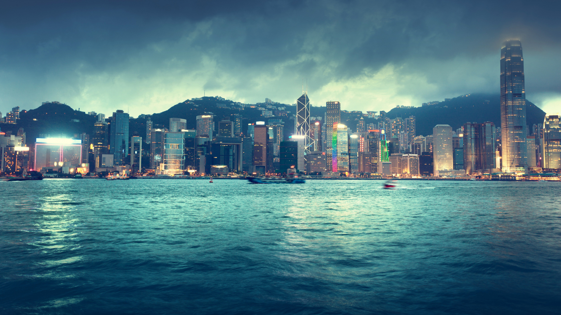 City Skyline Across Body of Water During Night Time. Wallpaper in 1920x1080 Resolution