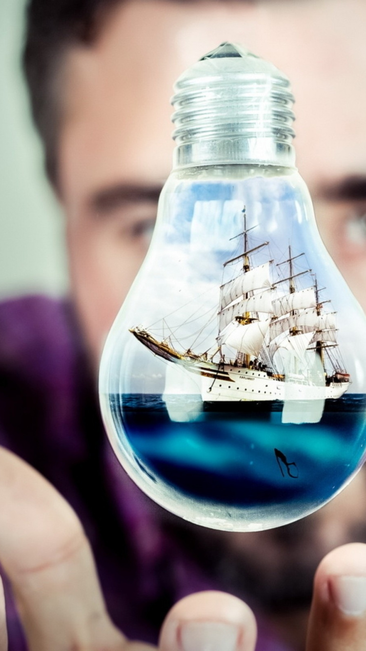 Person Holding Clear Glass Bottle With Water. Wallpaper in 750x1334 Resolution