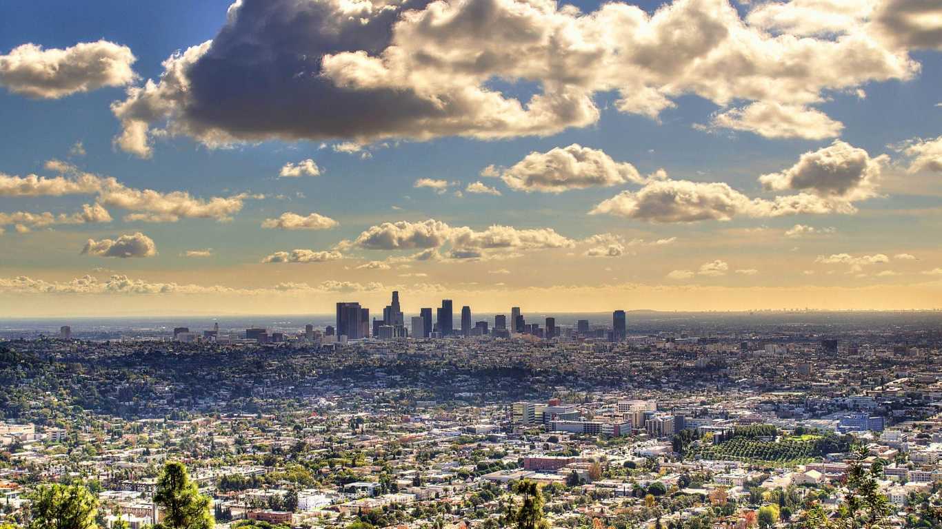 City Skyline Under White Clouds and Blue Sky During Daytime. Wallpaper in 1366x768 Resolution
