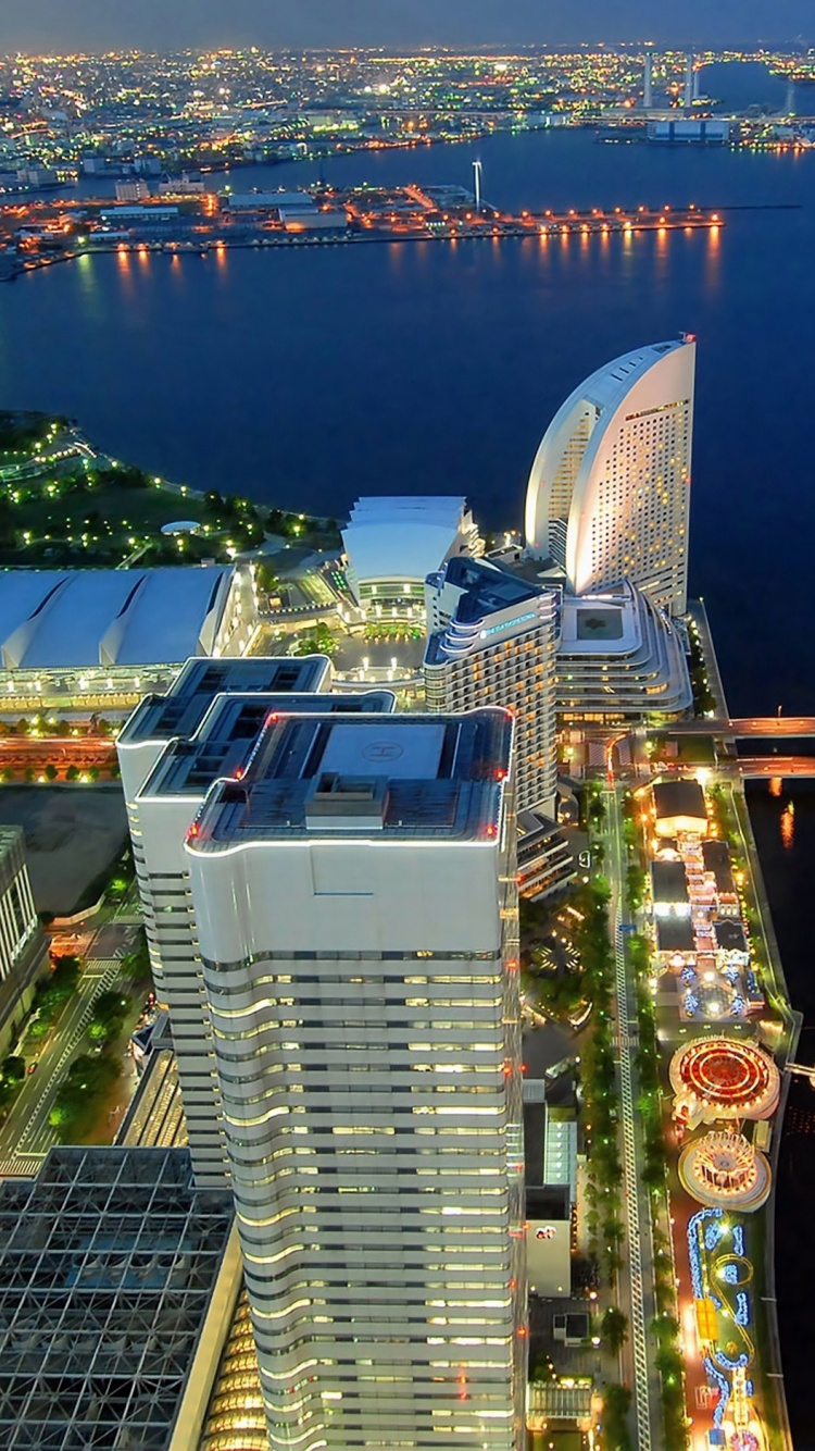 Aerial View of City Buildings During Night Time. Wallpaper in 750x1334 Resolution