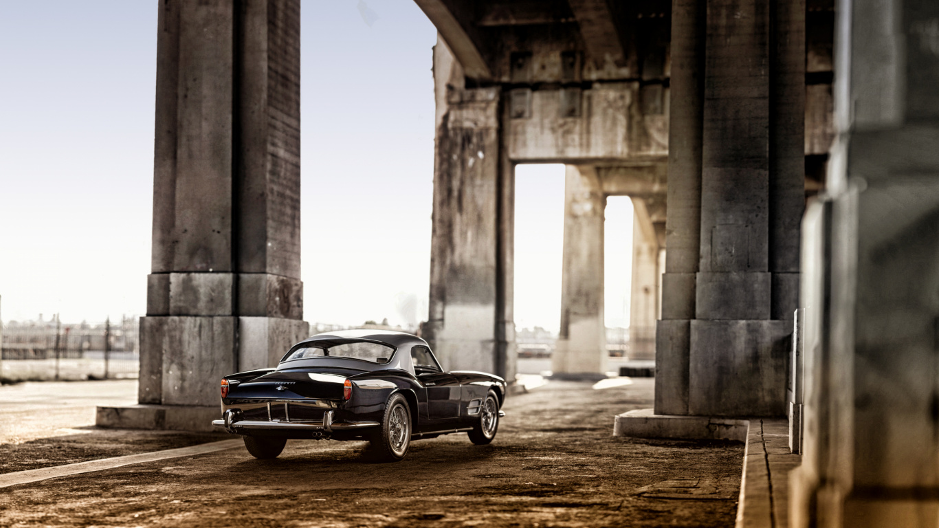 Black Coupe Parked Near Concrete Building During Daytime. Wallpaper in 1366x768 Resolution