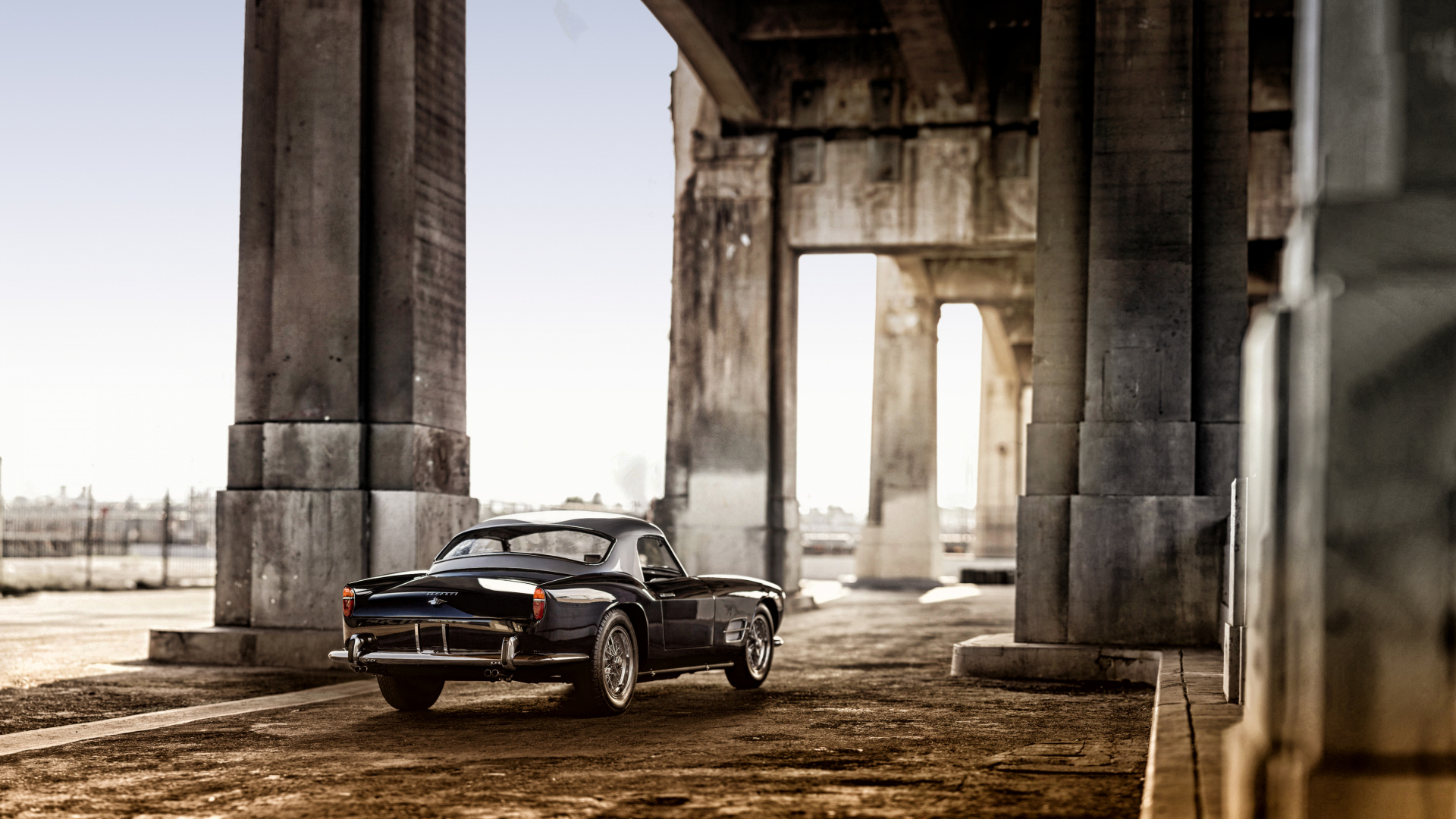 Black Coupe Parked Near Concrete Building During Daytime. Wallpaper in 1920x1080 Resolution