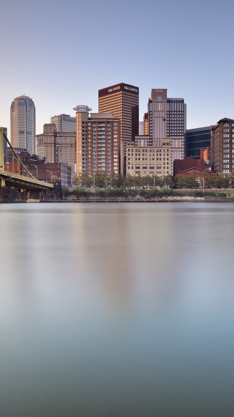 Body of Water Near City Buildings During Daytime. Wallpaper in 750x1334 Resolution
