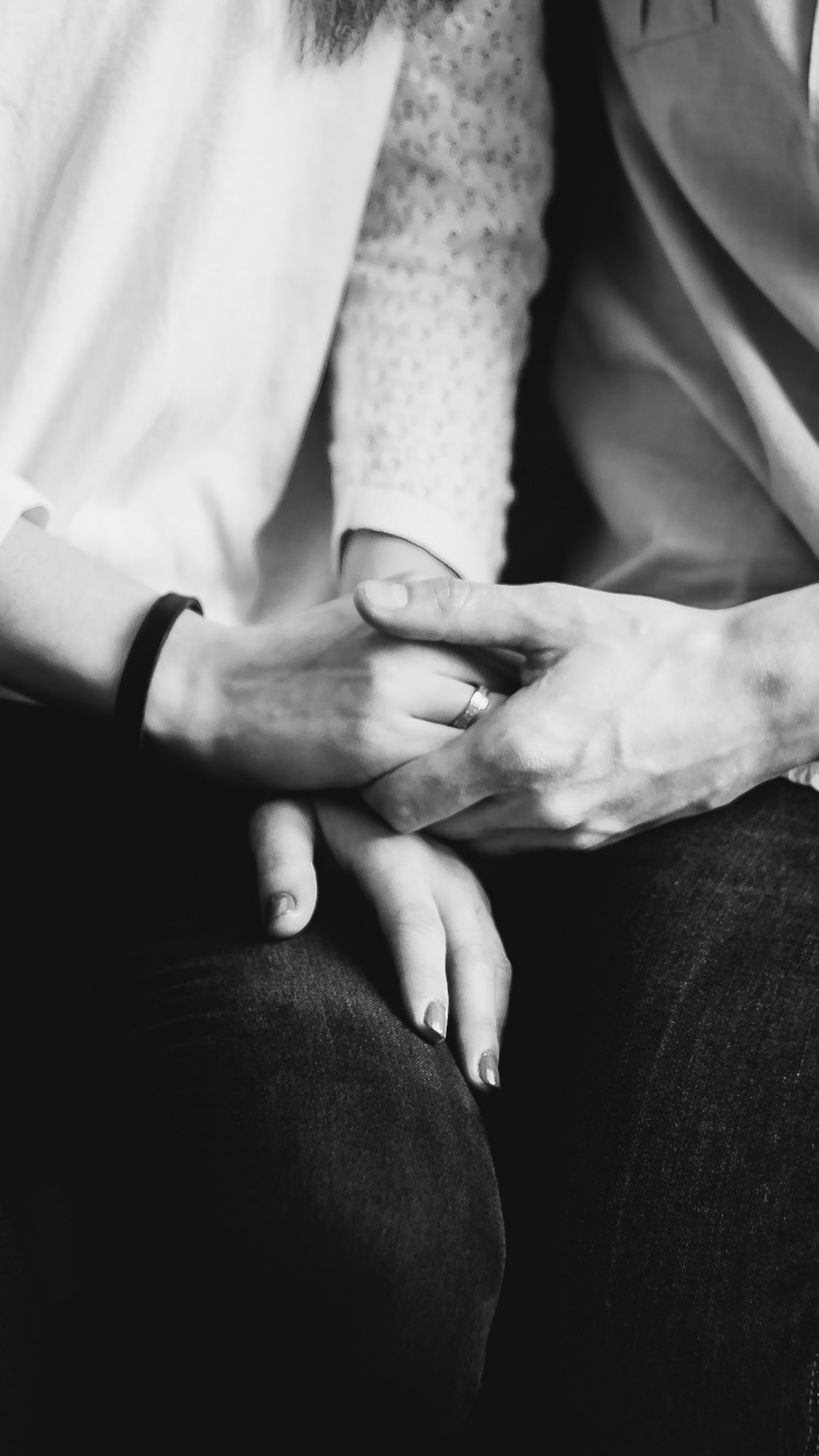 Grayscale Photo of Man and Woman Holding Hands. Wallpaper in 750x1334 Resolution