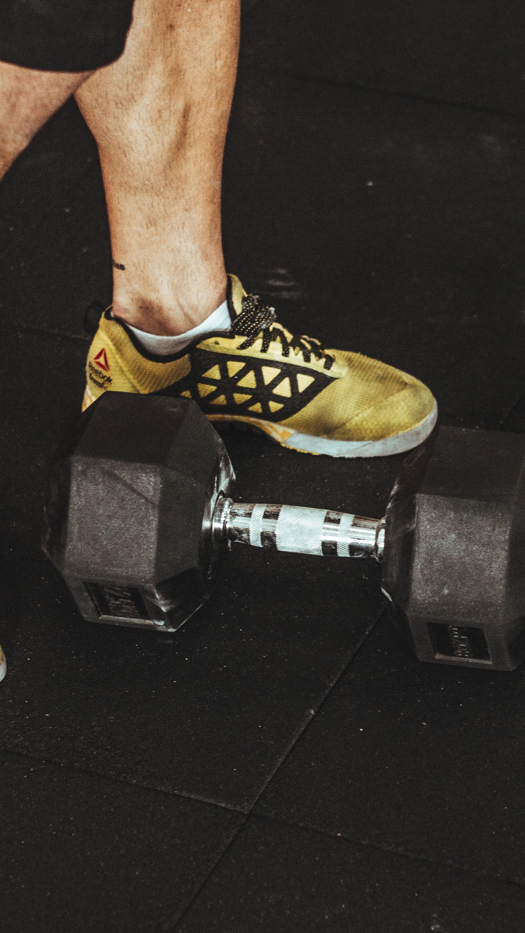 Person Wearing Yellow and Black Nike Athletic Shoes. Wallpaper in 1080x1920 Resolution