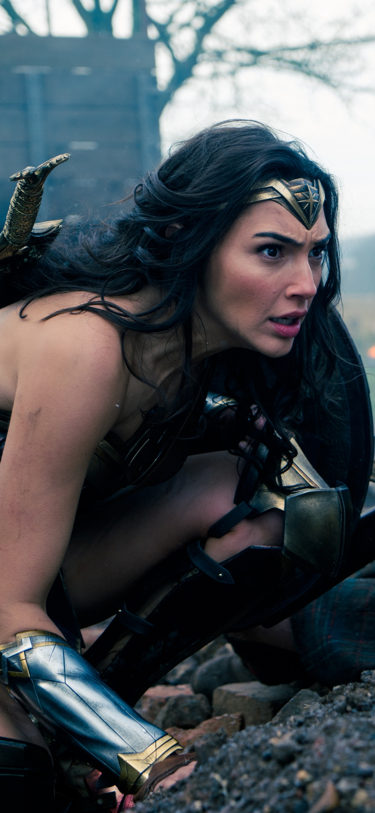 Mujer en Camiseta Negra Sentada Sobre Roca Negra y Marrón Durante el Día. Wallpaper in 1242x2688 Resolution