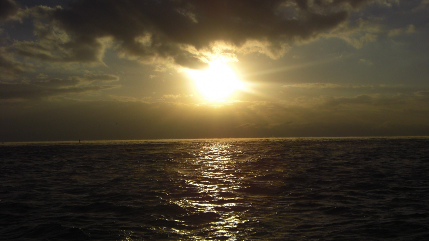 Body of Water Under Blue Sky During Daytime. Wallpaper in 1366x768 Resolution