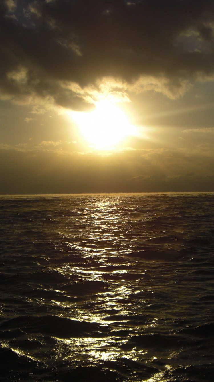 Body of Water Under Blue Sky During Daytime. Wallpaper in 750x1334 Resolution