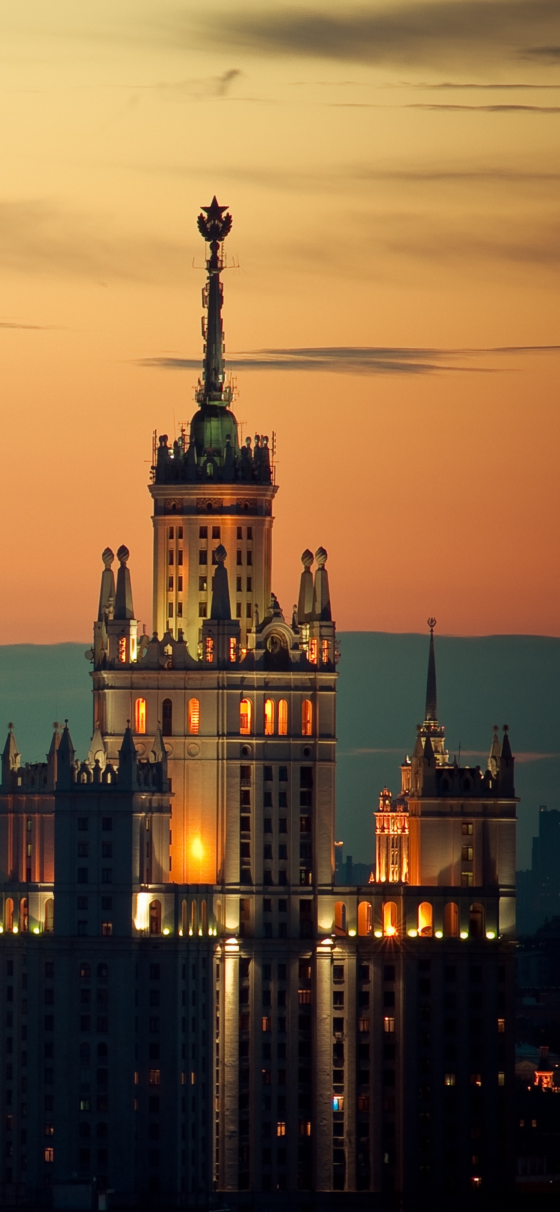 City With High Rise Buildings During Sunset. Wallpaper in 1125x2436 Resolution