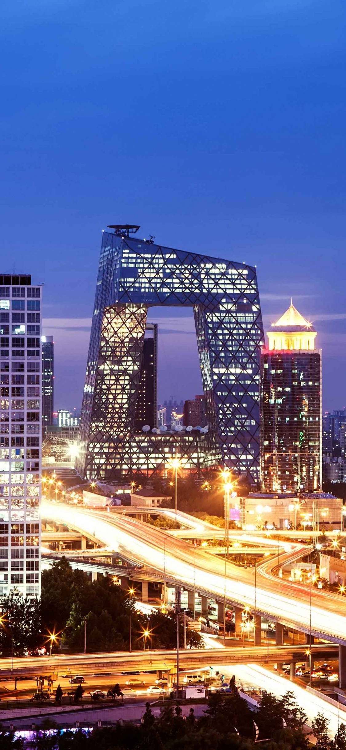 City Buildings During Night Time. Wallpaper in 1125x2436 Resolution