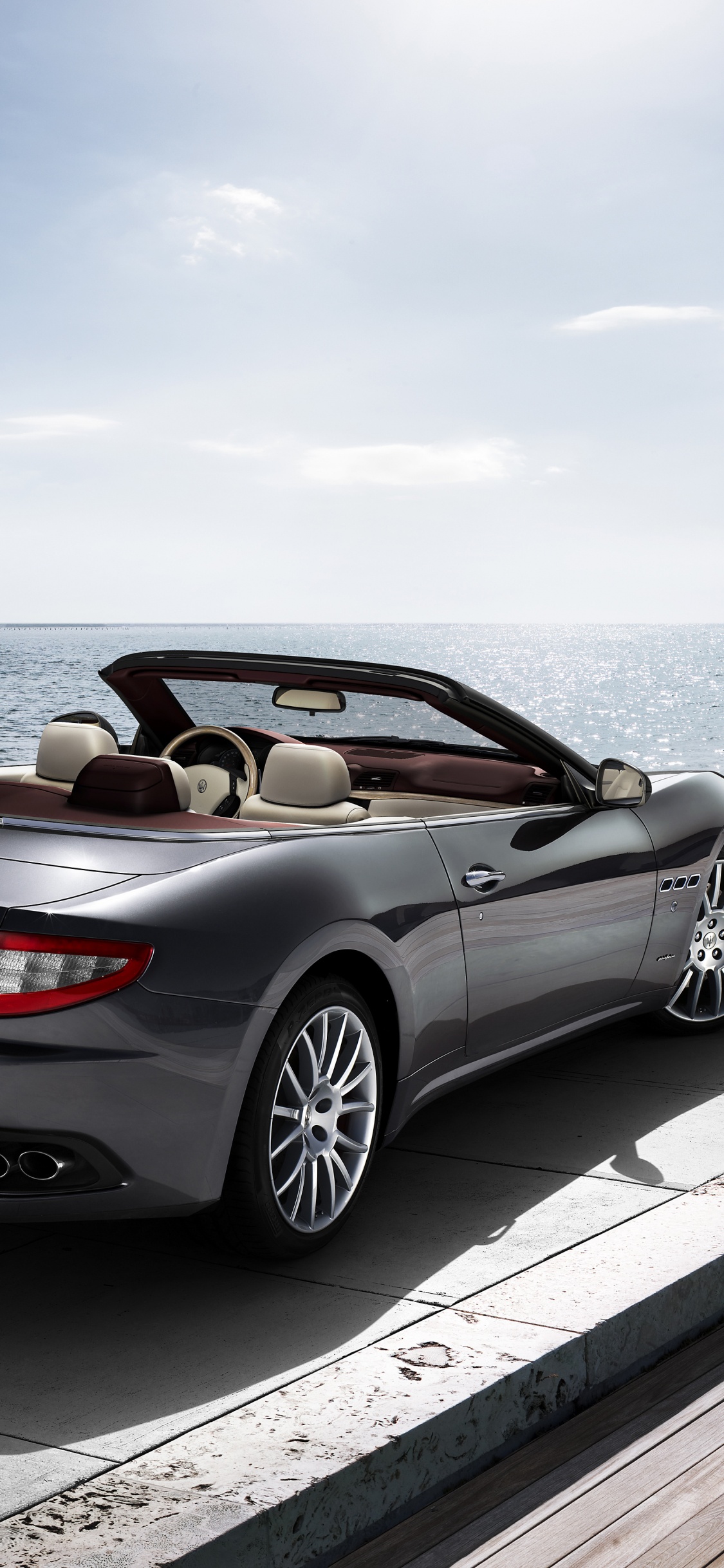 Silver Mercedes Benz Convertible Coupe Parked on Dock During Daytime. Wallpaper in 1125x2436 Resolution