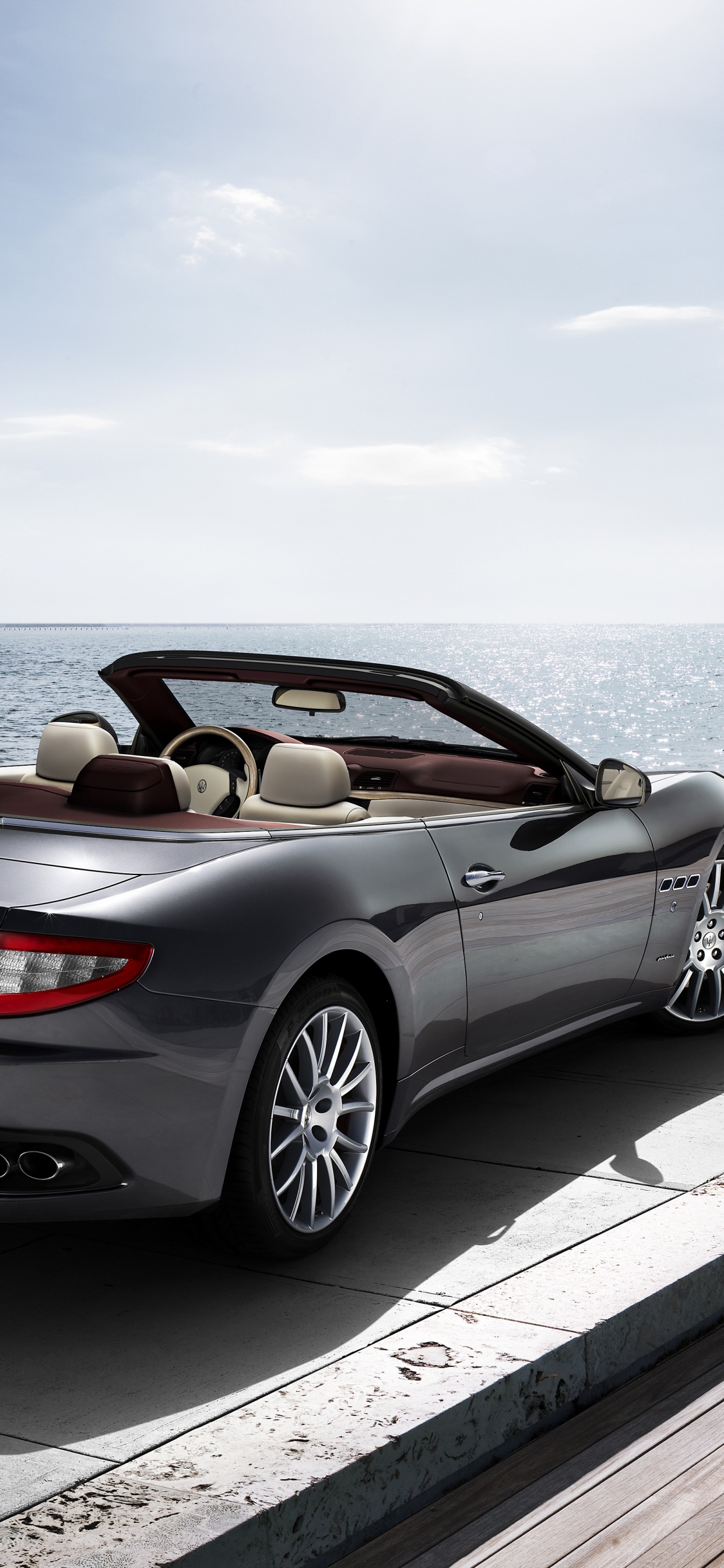 Silver Mercedes Benz Convertible Coupe Parked on Dock During Daytime. Wallpaper in 1242x2688 Resolution