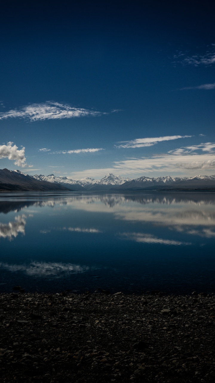 Body of Water Near Mountain Under Blue Sky During Daytime. Wallpaper in 720x1280 Resolution