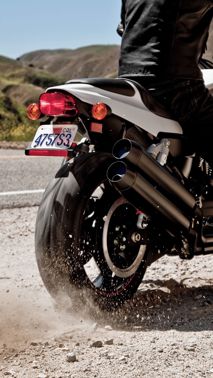 Man in Black Jacket Riding Motorcycle on Road During Daytime. Wallpaper in 720x1280 Resolution