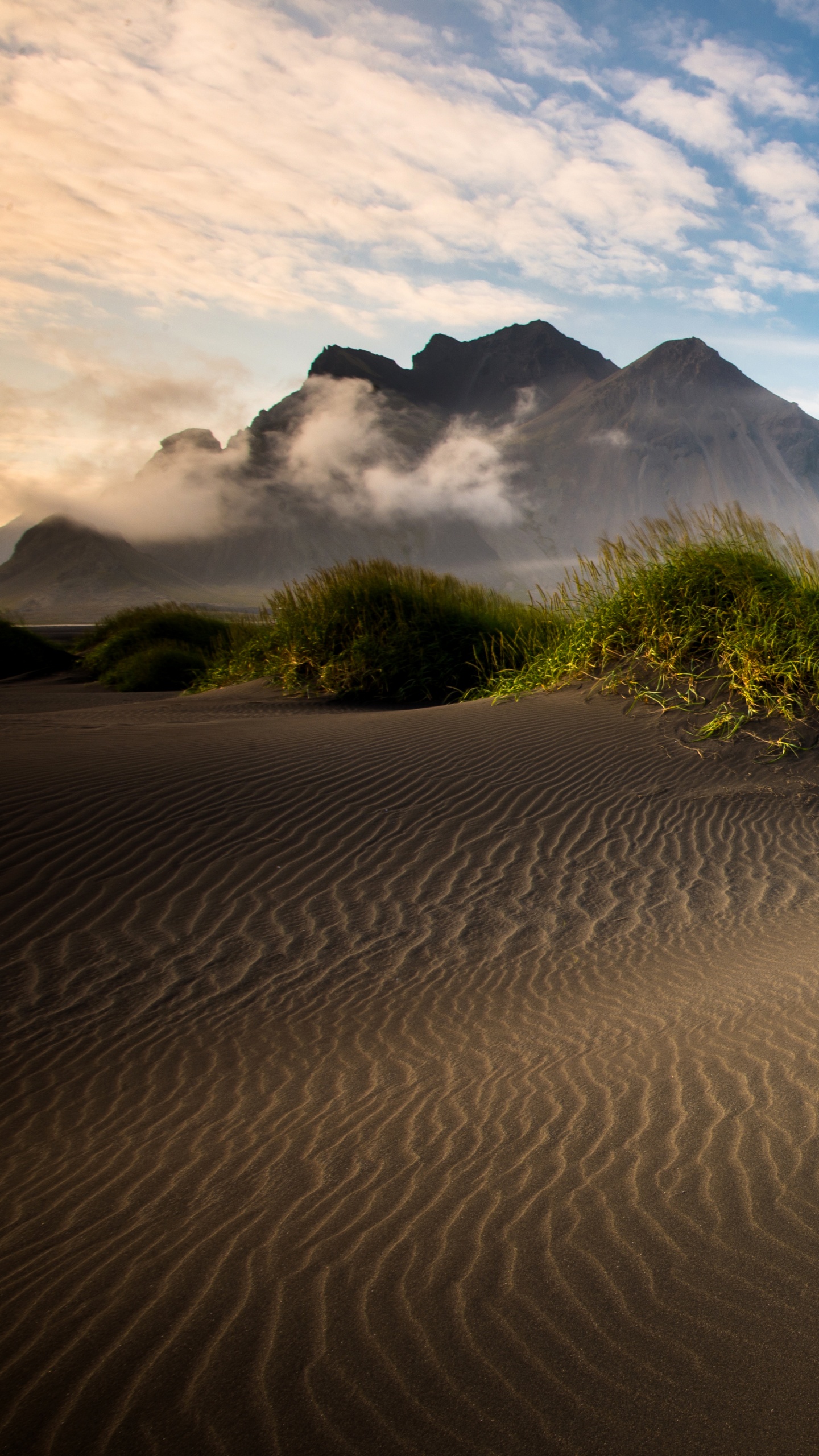 Green Grass on Brown Sand Under Blue Sky During Daytime. Wallpaper in 1440x2560 Resolution