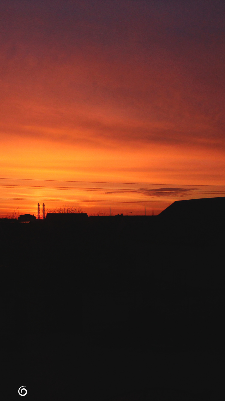Silhouette Des Gebäudes Bei Sonnenuntergang. Wallpaper in 750x1334 Resolution