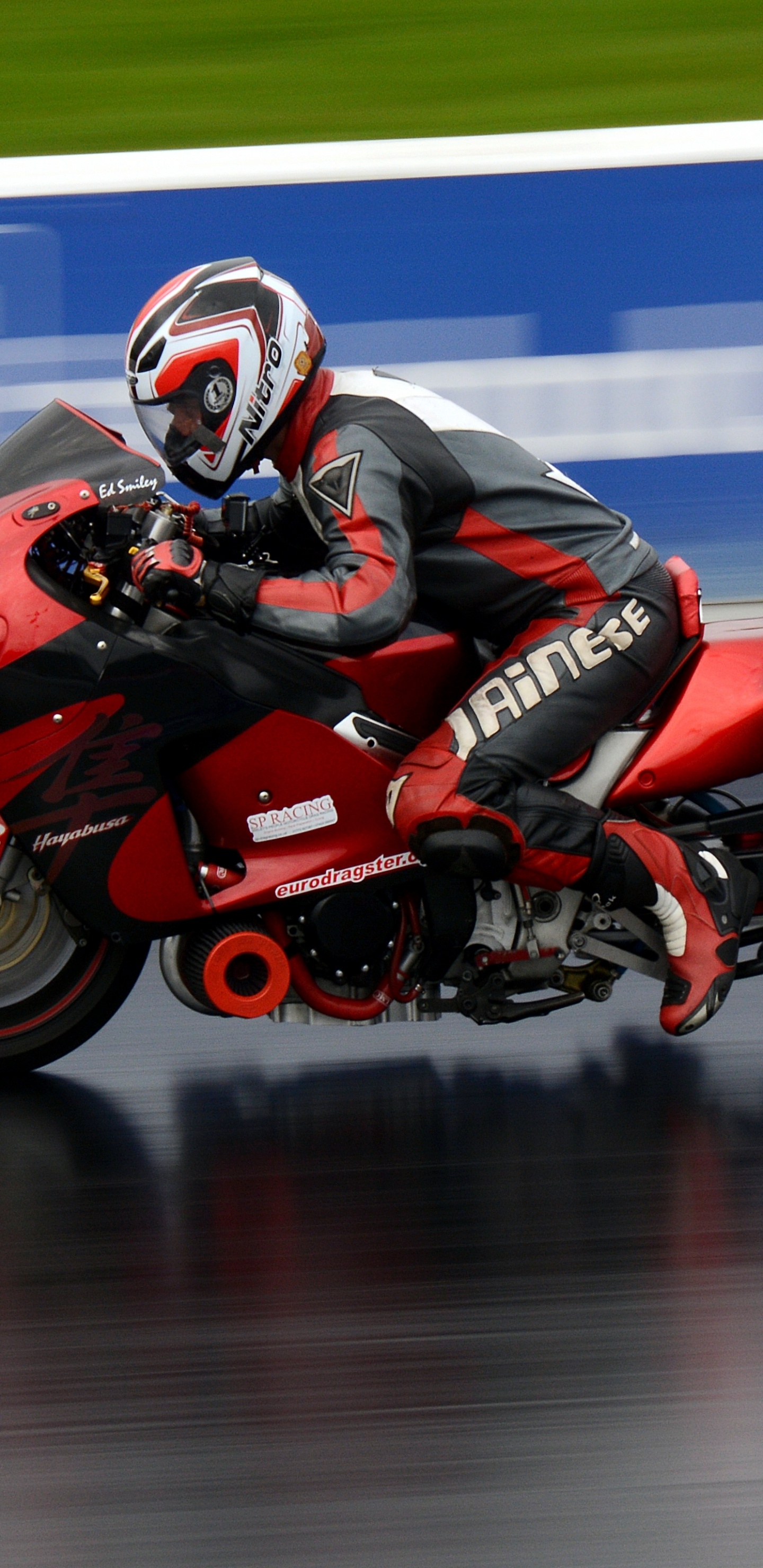 Man in Red and Black Motorcycle Helmet Riding Red Sports Bike. Wallpaper in 1440x2960 Resolution