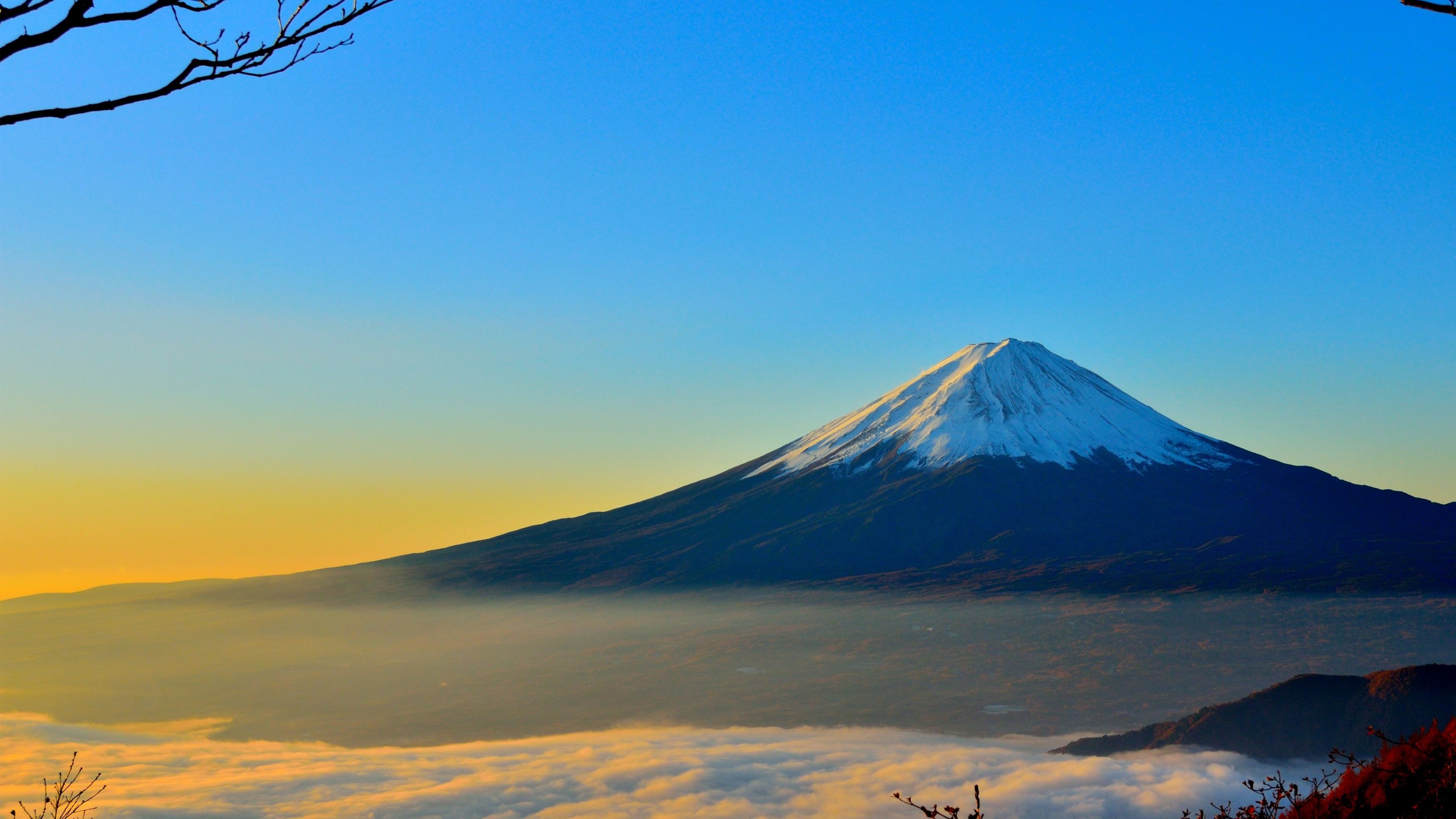 Snow Covered Mountain Under Blue Sky During Daytime. Wallpaper in 2560x1440 Resolution