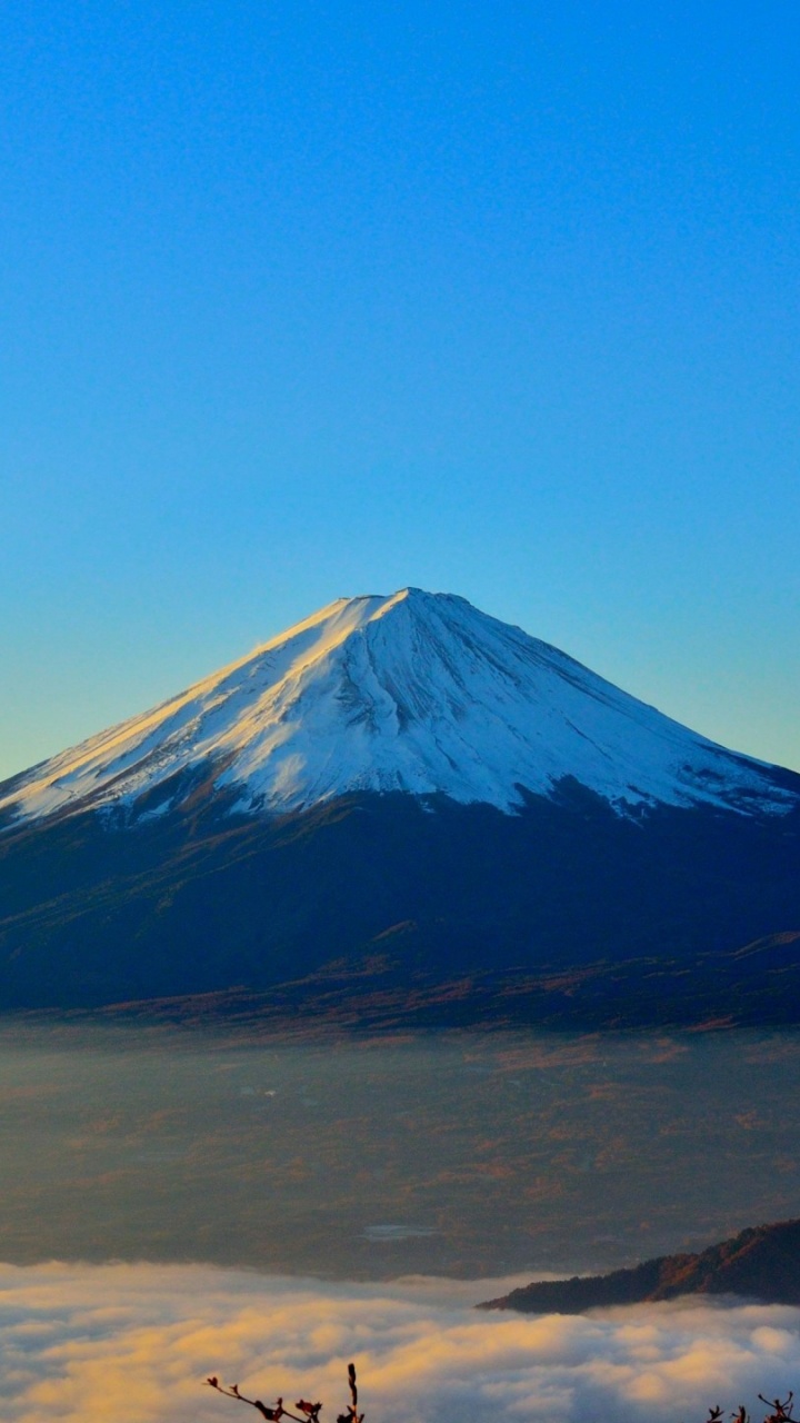 Snow Covered Mountain Under Blue Sky During Daytime. Wallpaper in 720x1280 Resolution
