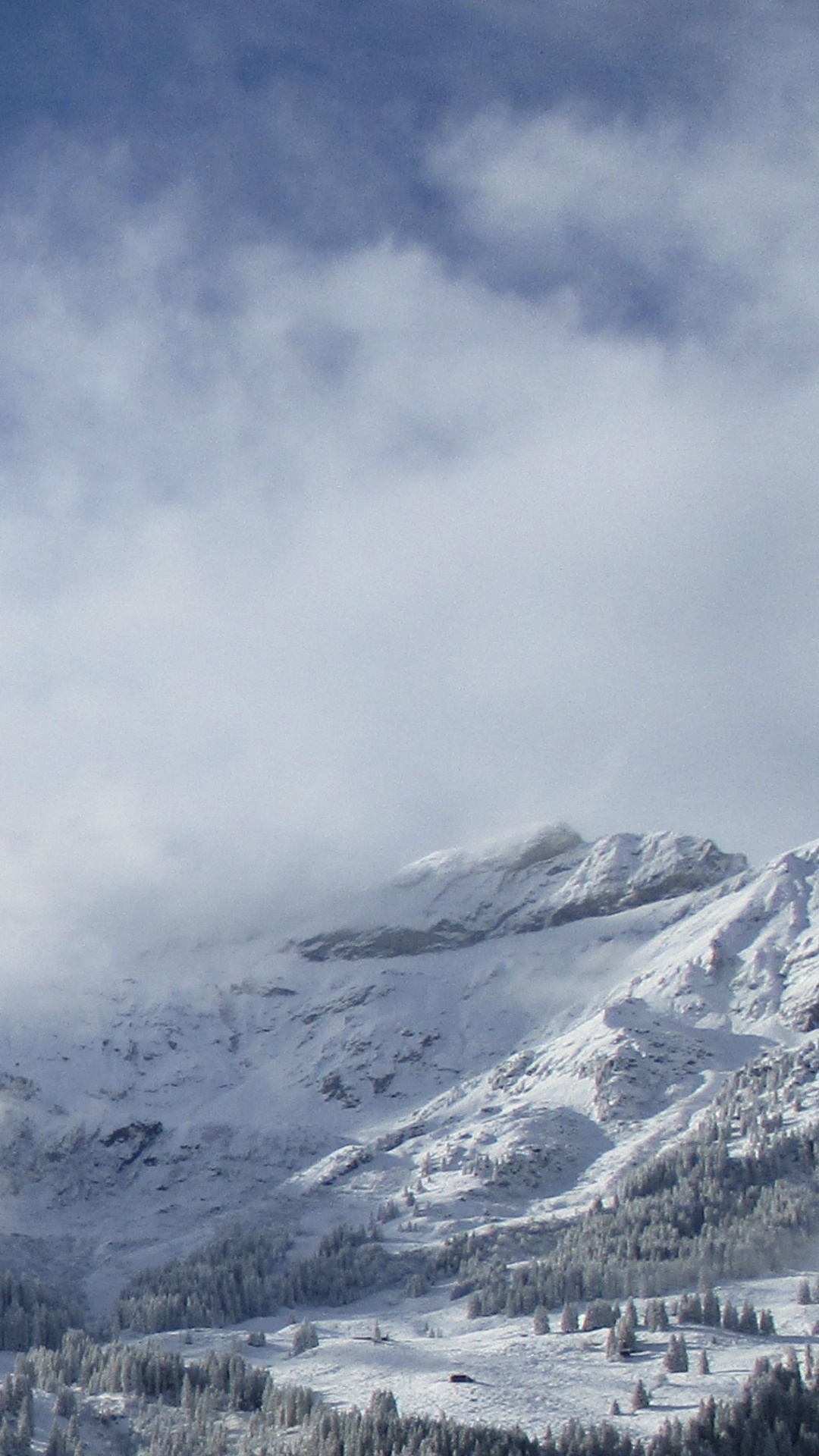 Schneebedeckte Berge Unter Bewölktem Himmel Tagsüber. Wallpaper in 1080x1920 Resolution