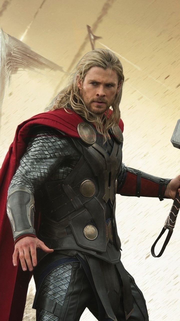 Man in Green and Brown Camouflage Suit Holding Black and Gray Power Tool. Wallpaper in 720x1280 Resolution