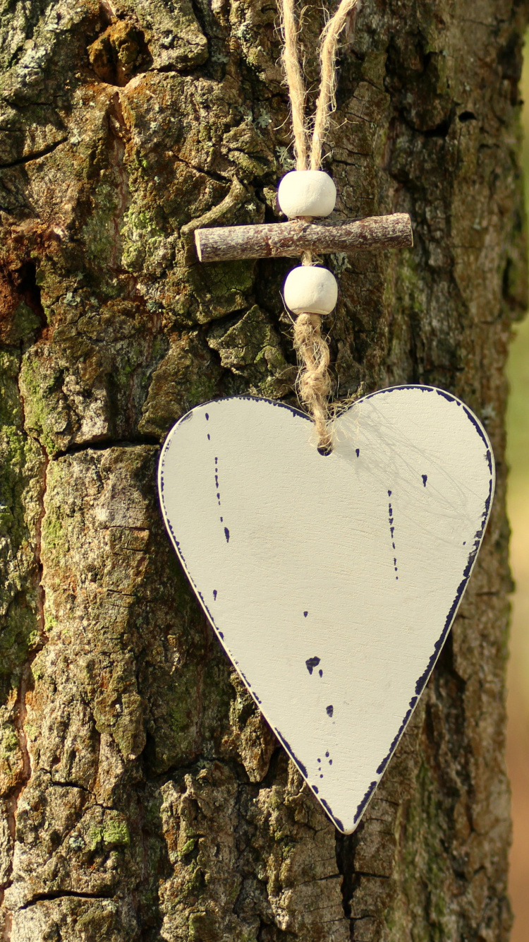 White Heart Shaped Hanging Ornament. Wallpaper in 750x1334 Resolution