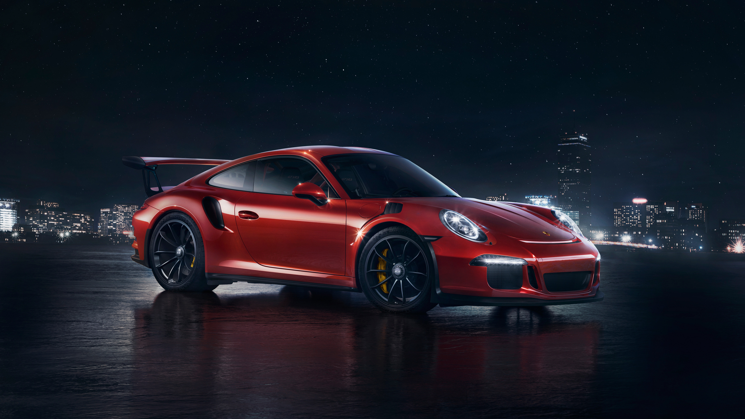 Porsche 911 Rojo Sobre Superficie Negra. Wallpaper in 2560x1440 Resolution