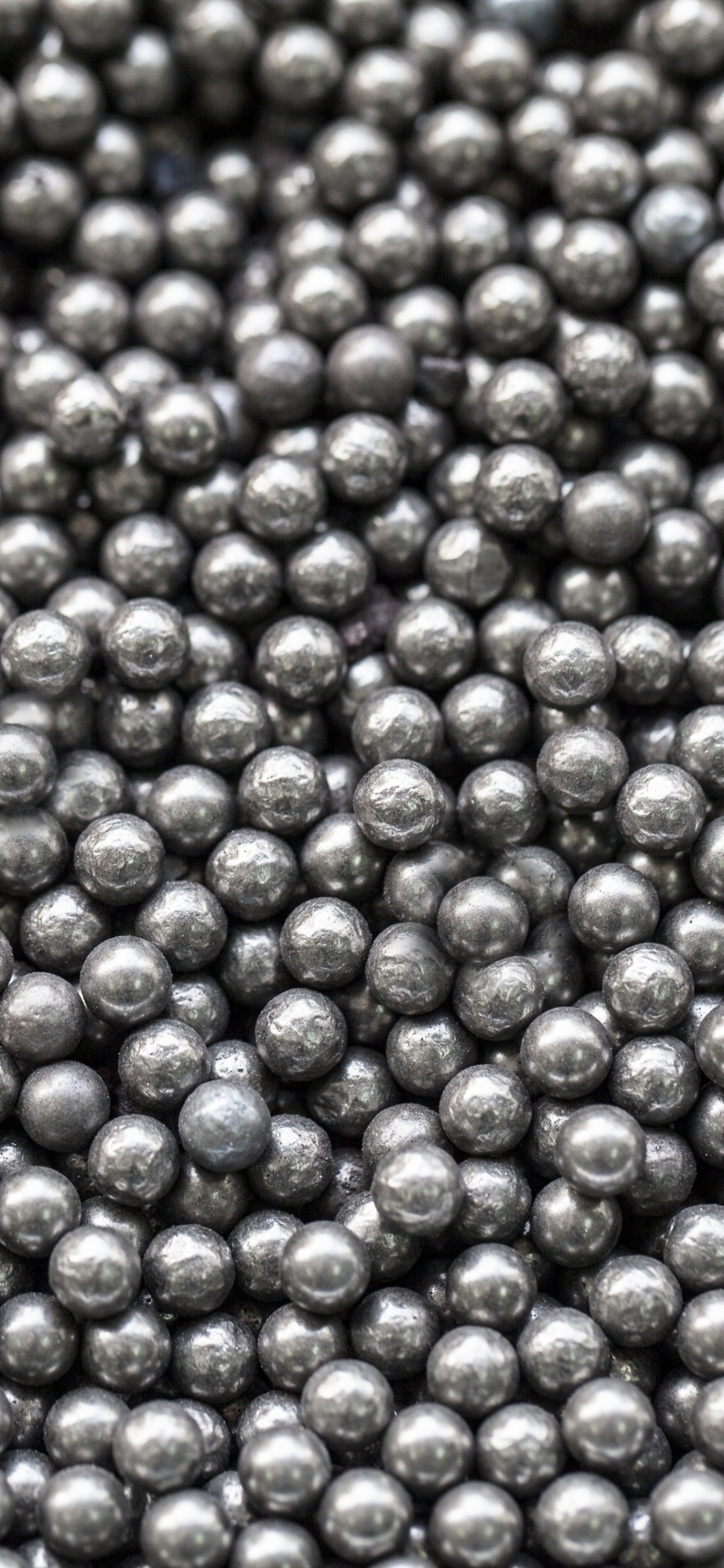 Purple and Green Round Fruits. Wallpaper in 1125x2436 Resolution