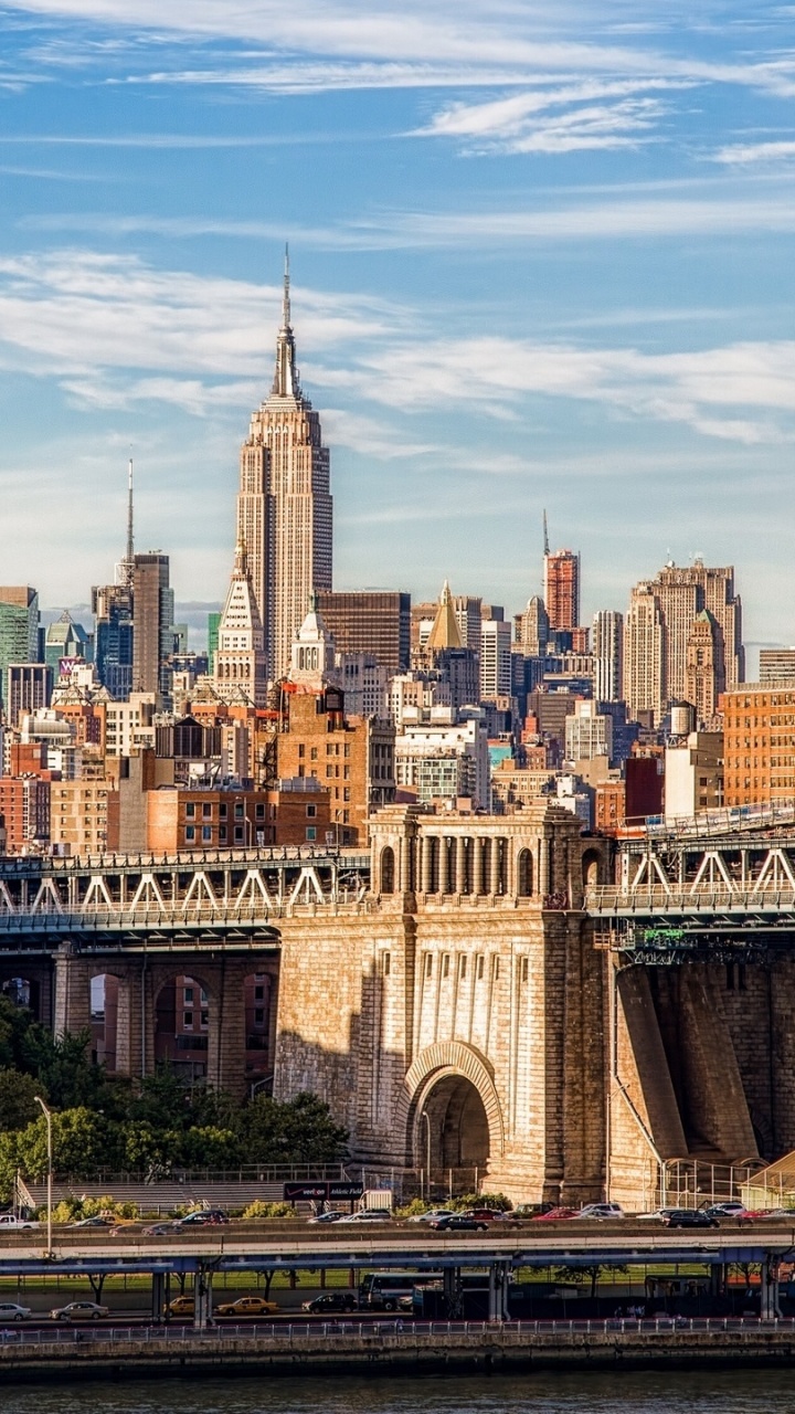 Brown Concrete Bridge Over City Buildings During Daytime. Wallpaper in 720x1280 Resolution