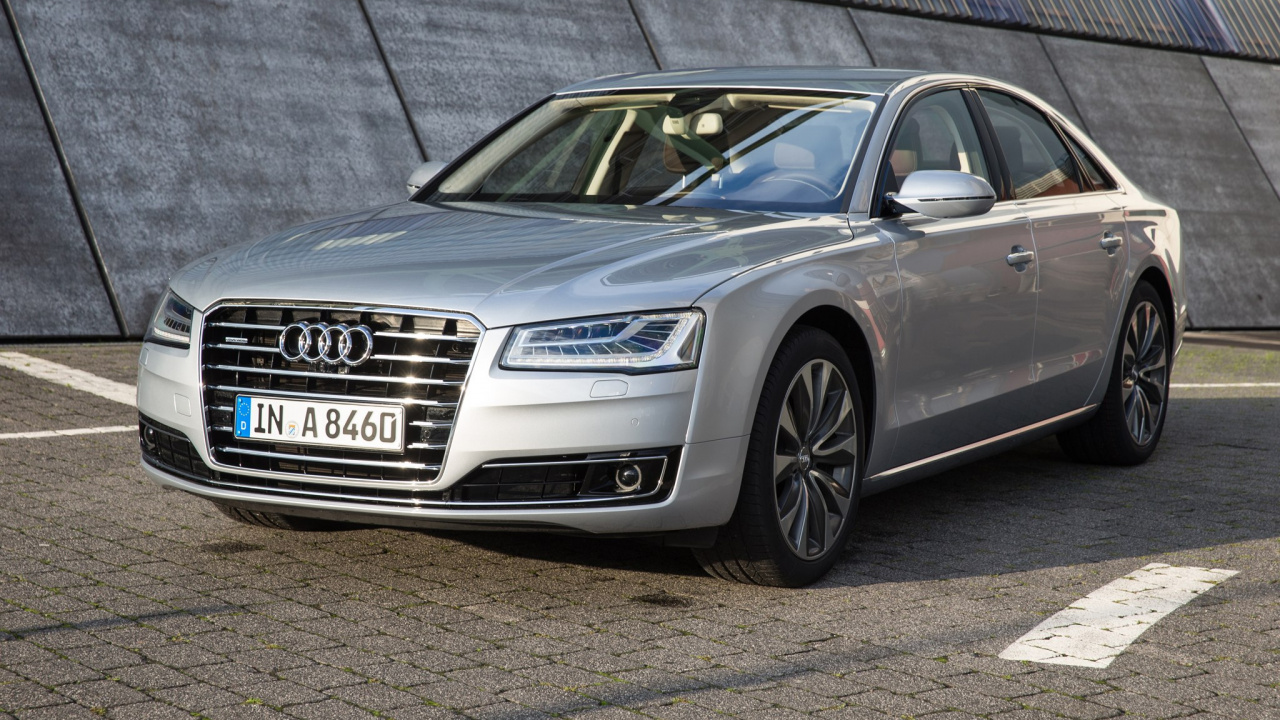 Silver Audi Coupe Parked on Parking Lot. Wallpaper in 1280x720 Resolution
