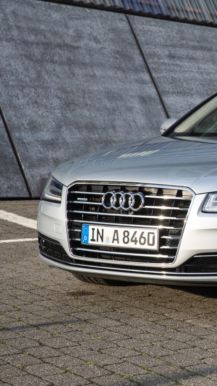 Silver Audi Coupe Parked on Parking Lot. Wallpaper in 720x1280 Resolution