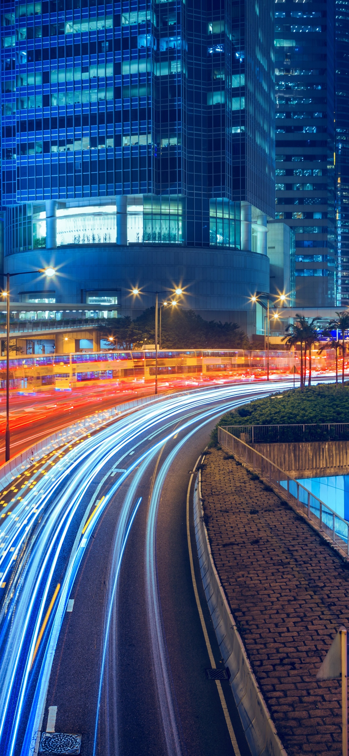 Time Lapse Photography of City Road During Night Time. Wallpaper in 1125x2436 Resolution