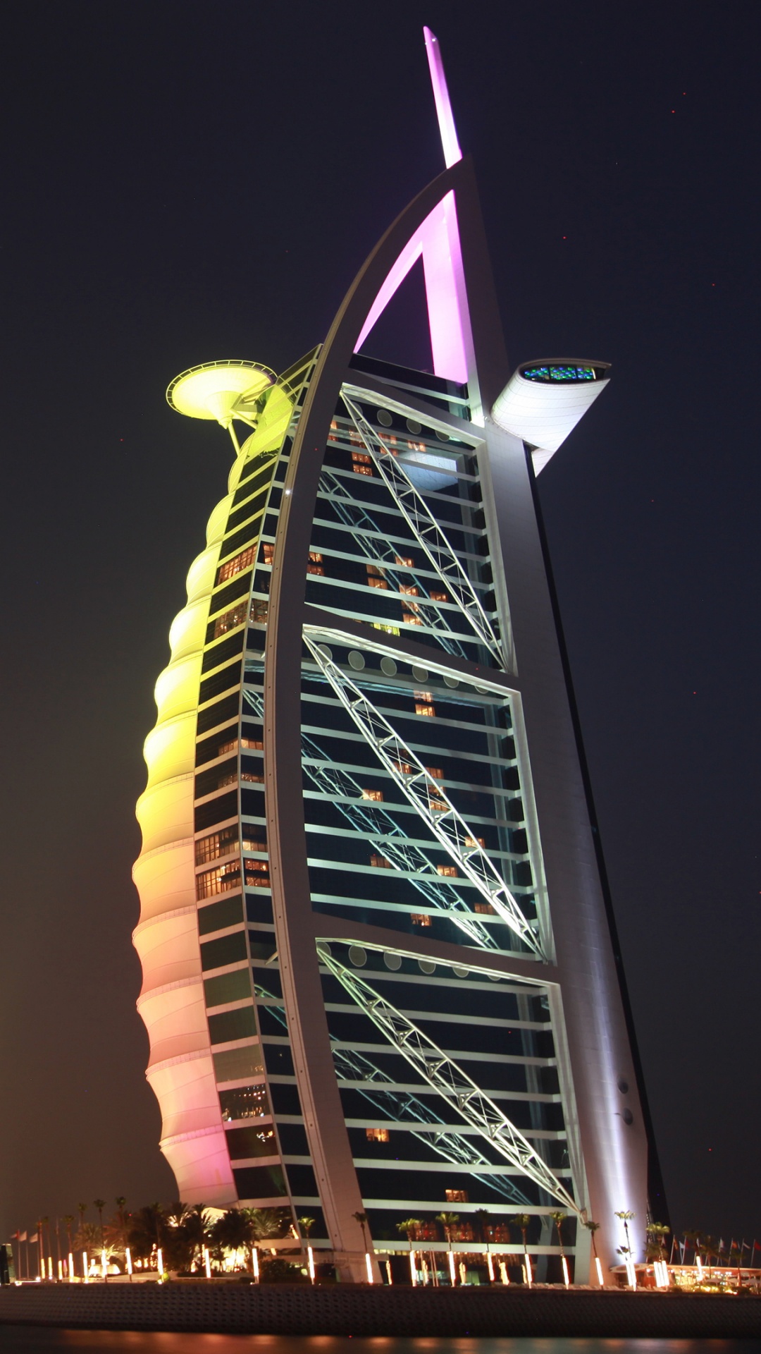 Ferris Wheel Near City Buildings During Night Time. Wallpaper in 1080x1920 Resolution