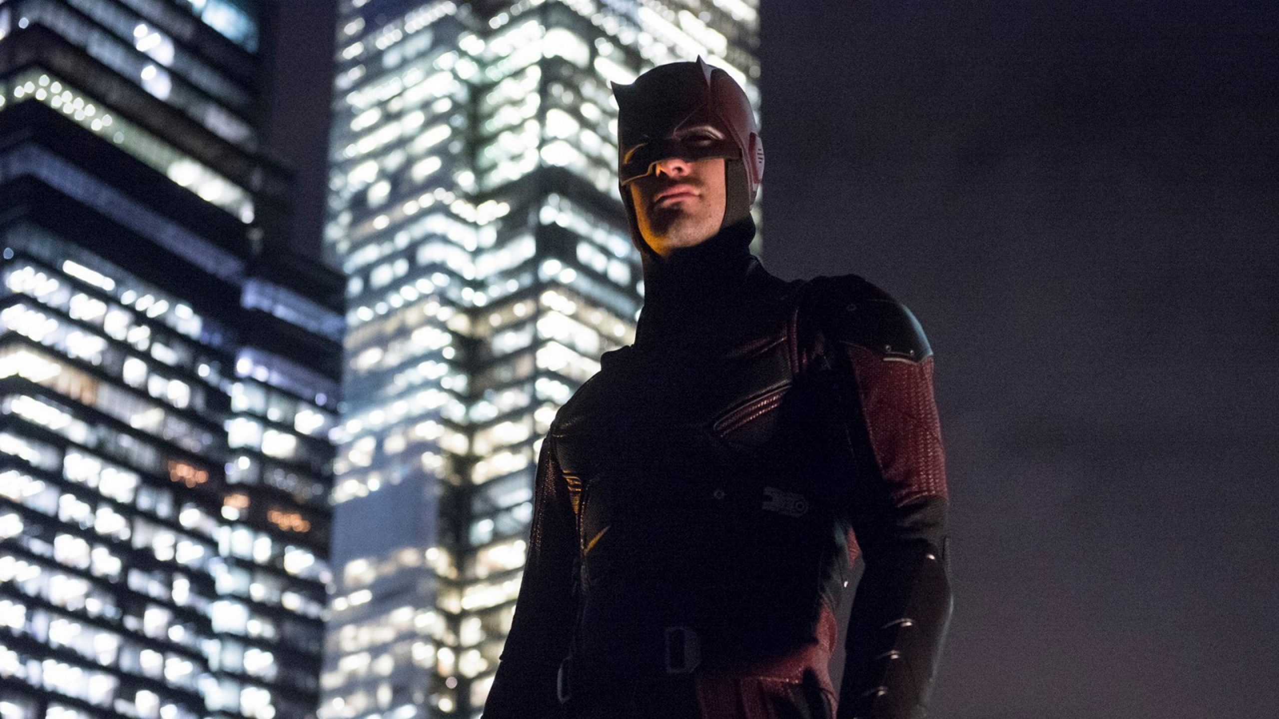 Man in Black Jacket and Red Knit Cap. Wallpaper in 2560x1440 Resolution