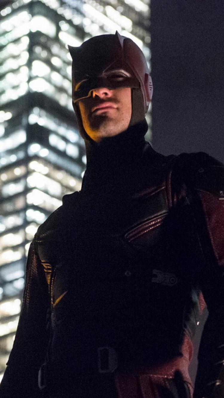 Man in Black Jacket and Red Knit Cap. Wallpaper in 750x1334 Resolution