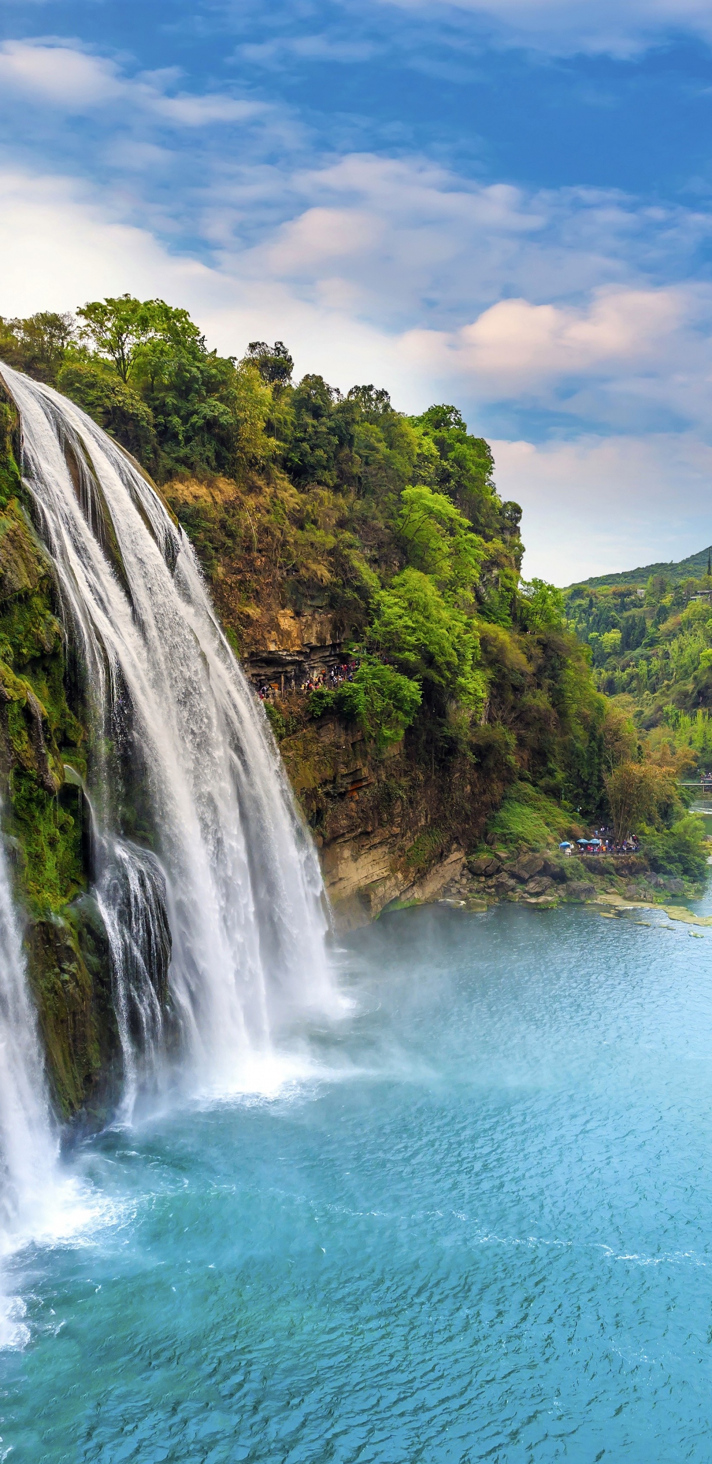 Waterfalls on Green Grass Covered Mountain During Daytime. Wallpaper in 1440x2960 Resolution