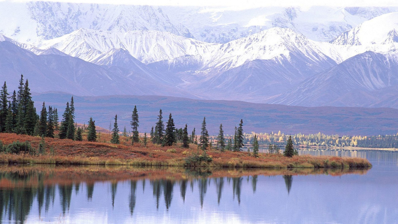 Green Trees Near Lake and Snow Covered Mountain During Daytime. Wallpaper in 1366x768 Resolution