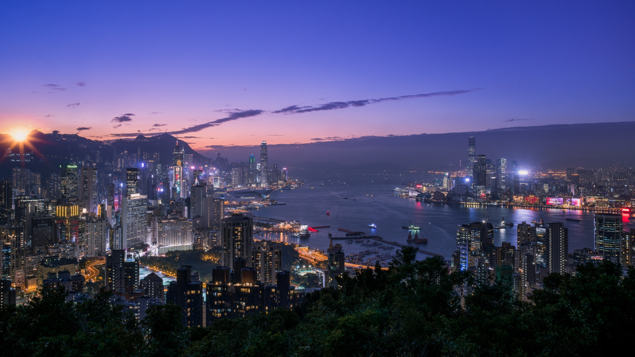 City Skyline Near Body of Water During Night Time. Wallpaper in 1280x720 Resolution