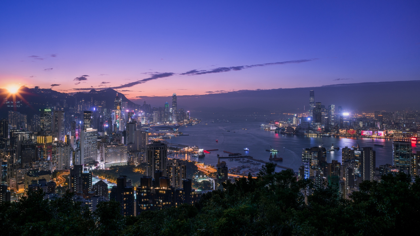 City Skyline Near Body of Water During Night Time. Wallpaper in 1366x768 Resolution