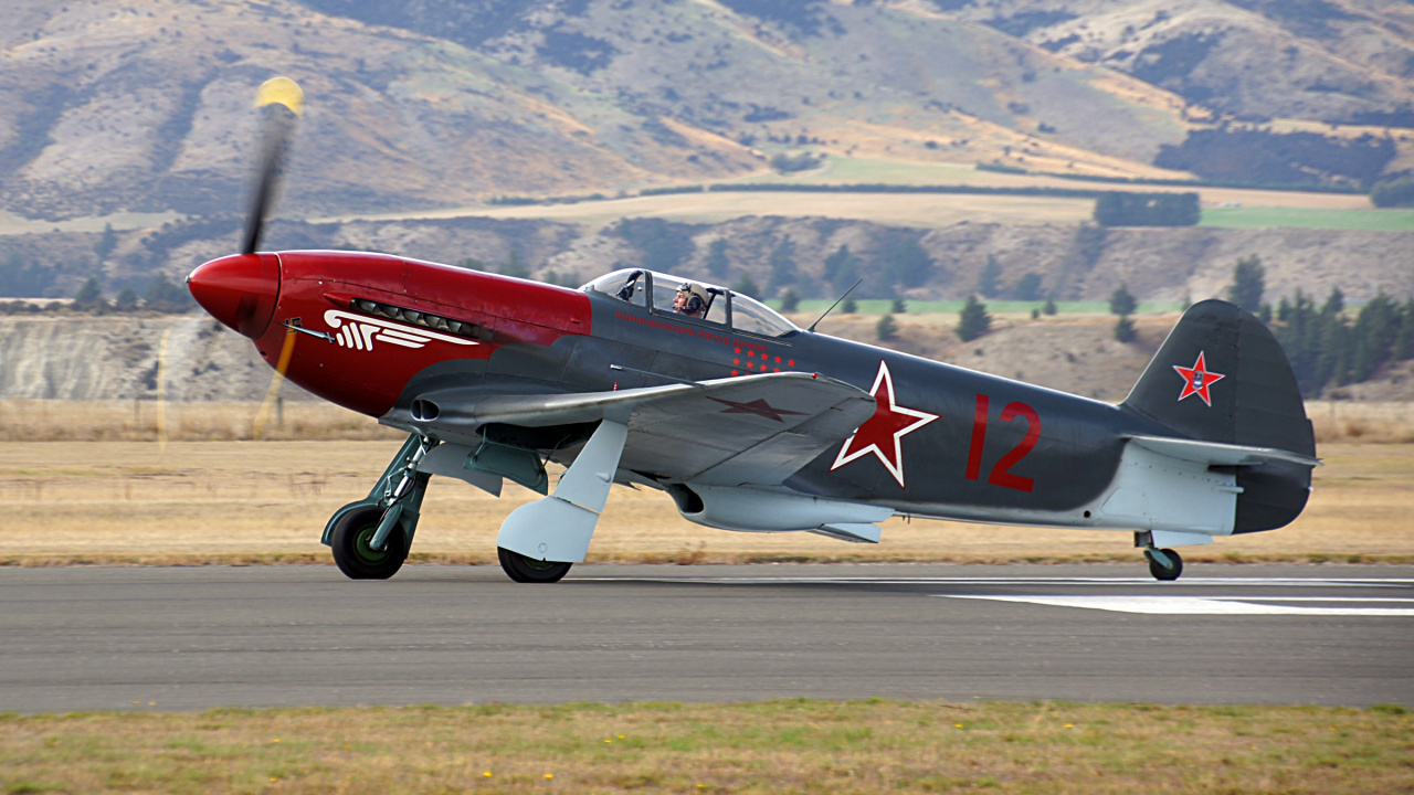 Red and White Jet Plane on Gray Concrete Road During Daytime. Wallpaper in 1280x720 Resolution