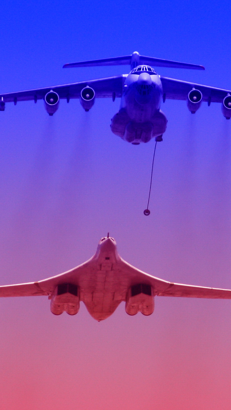 Blue and Brown Airplane Flying. Wallpaper in 750x1334 Resolution