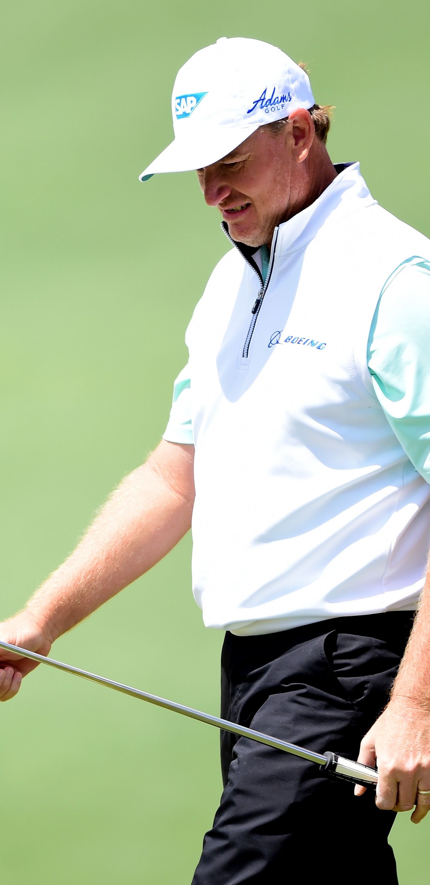 Man in White and Black Polo Shirt and White Cap Holding Golf Club During Daytime. Wallpaper in 1440x2960 Resolution