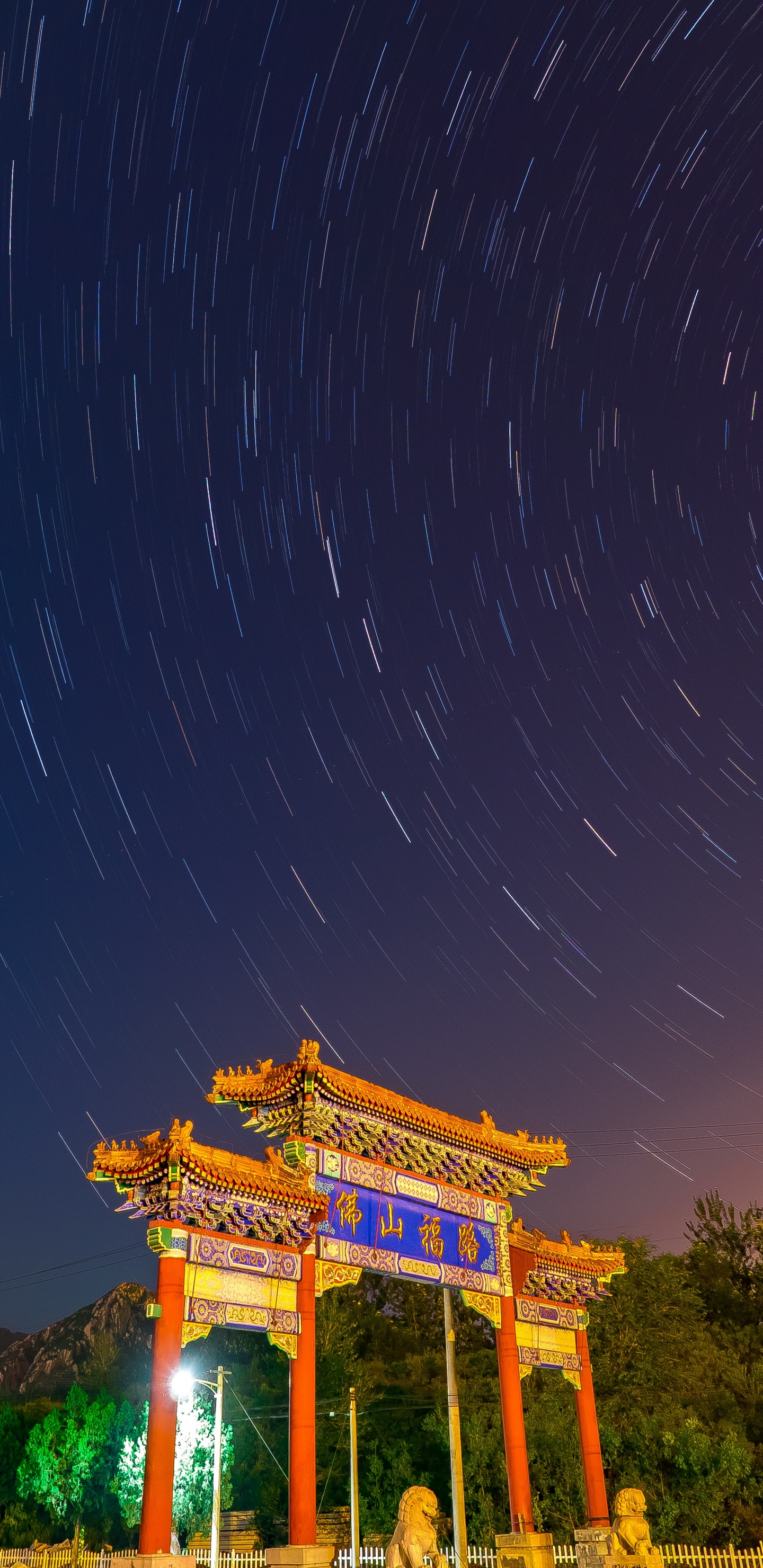 Brown Temple Under Blue Sky During Night Time. Wallpaper in 1440x2960 Resolution