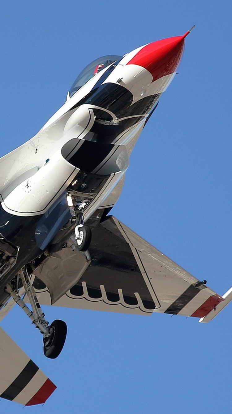 White and Red Jet Plane in Mid Air During Daytime. Wallpaper in 750x1334 Resolution