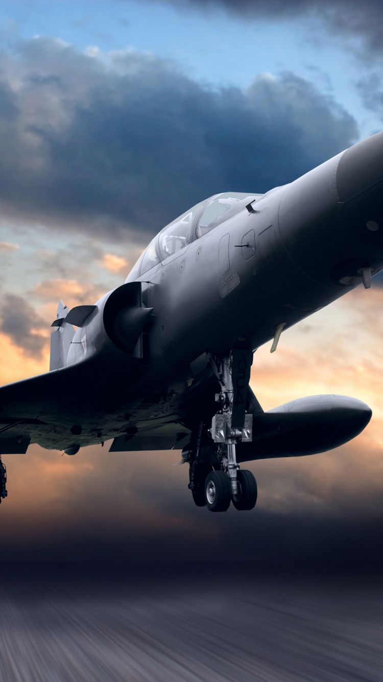 Avión de Combate Gris Bajo el Cielo Nublado Durante el Día. Wallpaper in 750x1334 Resolution