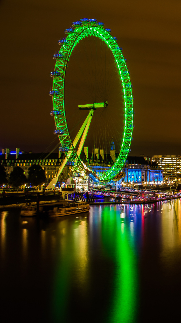 Ferris Wheel Near City Buildings During Night Time. Wallpaper in 750x1334 Resolution