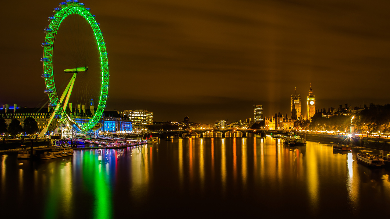 Riesenrad in Der Nähe Von Stadtgebäuden Während Der Nacht. Wallpaper in 1280x720 Resolution
