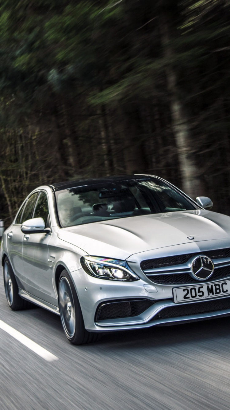 Mercedes Benz Coupé Noir Sur Route Pendant la Journée. Wallpaper in 750x1334 Resolution