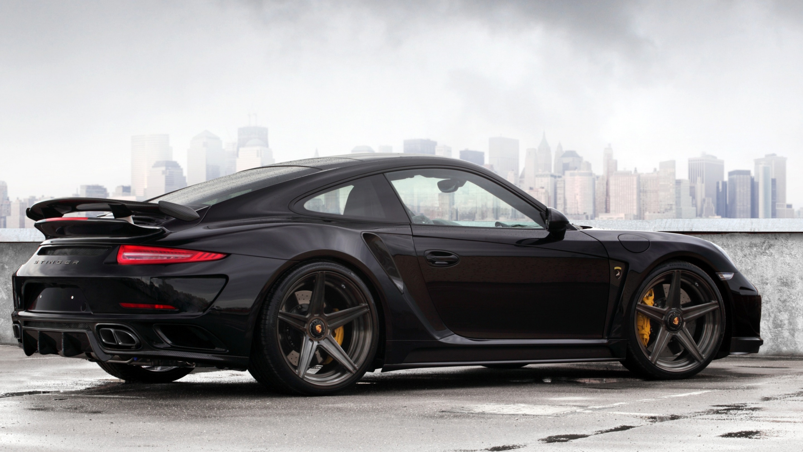 Black Coupe on Gray Asphalt Road During Daytime. Wallpaper in 2560x1440 Resolution