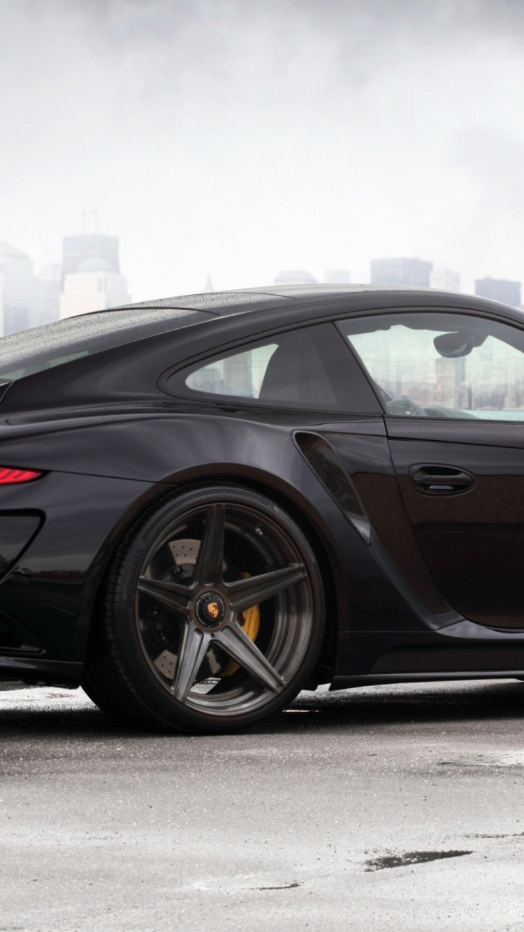 Black Coupe on Gray Asphalt Road During Daytime. Wallpaper in 750x1334 Resolution